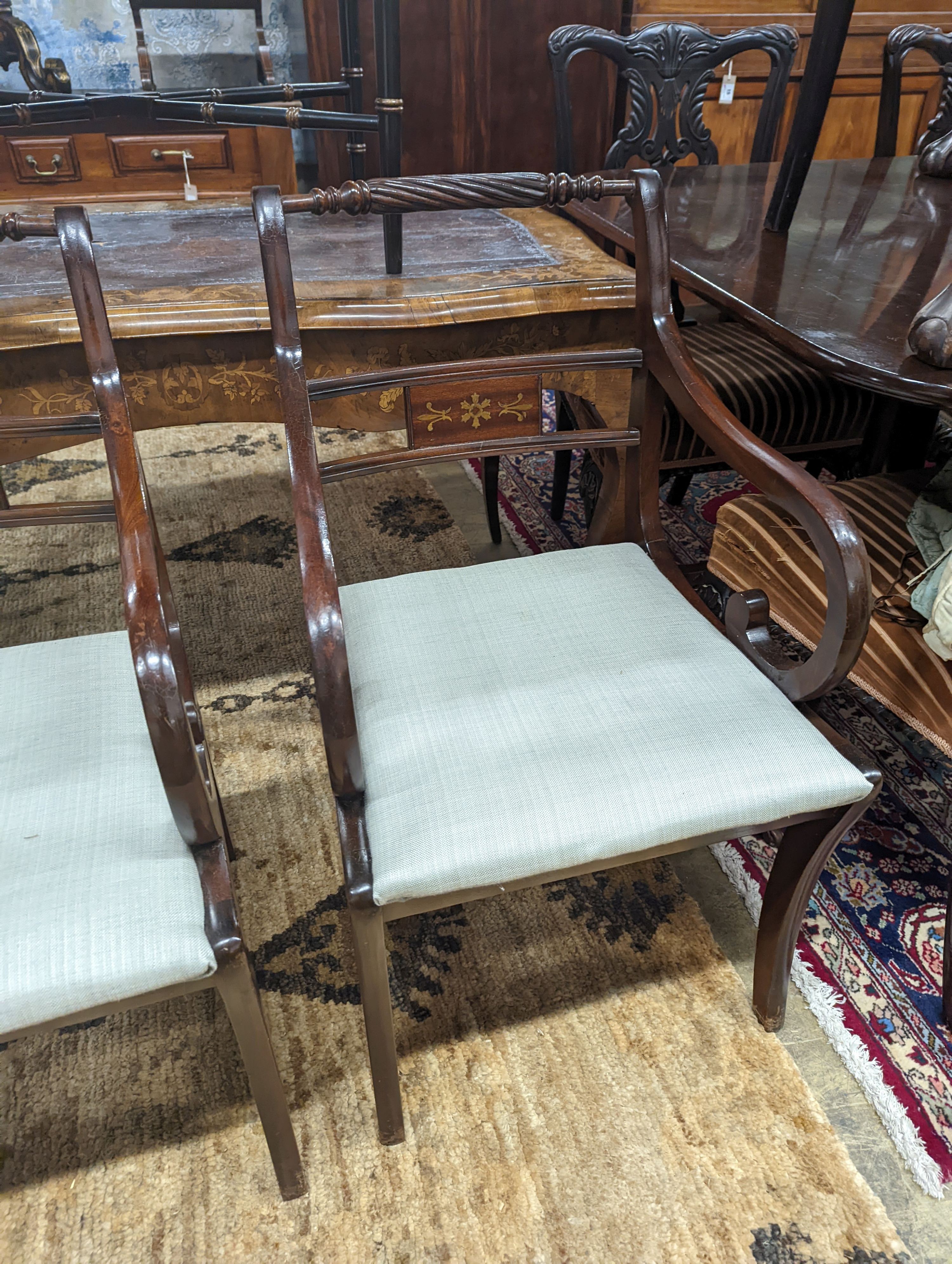 A pair of Regency style brass inlaid mahogany elbow chairs, width 48cm, depth 48cm, height 88cm